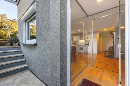 a pivot door in a home with a kitchen and dining room at Ferienwohnung Lilly in Hofgeismar