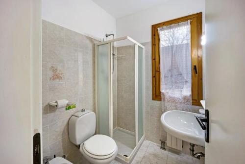 a bathroom with a toilet and a sink and a shower at Villaggio Colombo V3 comfort in Marina di Andora