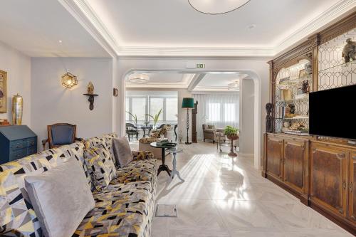 a living room with a couch and a tv at Casa Mourato - Smart and Eco Wonder in São Domingos de Rana