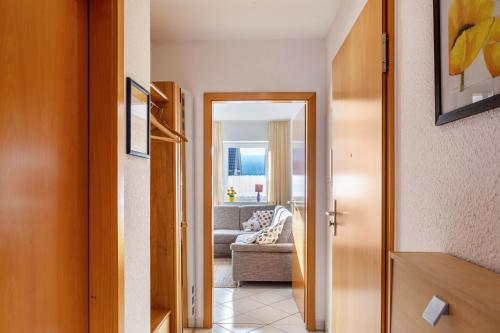 a hallway leading to a living room with a couch at Ferienwohnung Tannenblick 3-3 in Oberhof