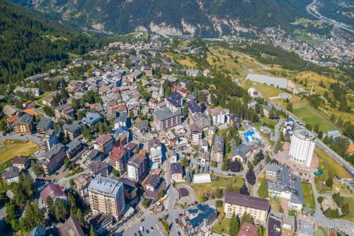 an aerial view of a town in the mountains at Studio Clotes Ski In - Ski Out - Happy Rentals in Sauze dʼOulx