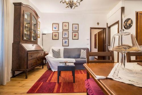 a living room with a couch and a table at Appartamento Collini in Spiazzo