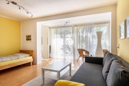 a living room with a couch and a table at Kocher und Jagst in Michelbach an der Bilz