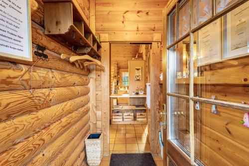 a hallway of a cabin with wooden walls at Ferienhaus Hohlwegstübchen in Sundern