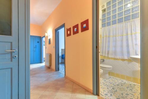 a bathroom with a toilet and a sink at Casa La Torre in Capoliveri