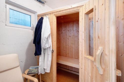 a wooden cabin with a sauna with a door at Agricola in Bad Säckingen
