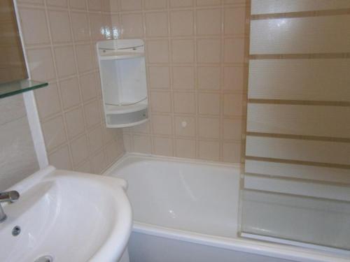 a bathroom with a sink and a toilet and a shower at Studio Les Fontettes 2 in Le Dévoluy