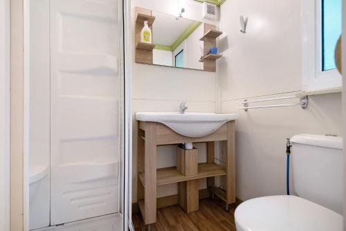 a bathroom with a sink and a toilet at chalet nel bosco in Casarza Ligure