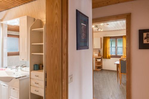 a small bathroom with a sink and a mirror at Familienwohnung Haus 18 in Überlingen