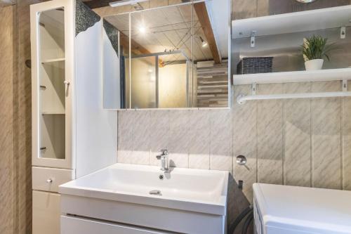 a bathroom with a sink and a mirror at Chalet Berger in Sankt Johann im Pongau