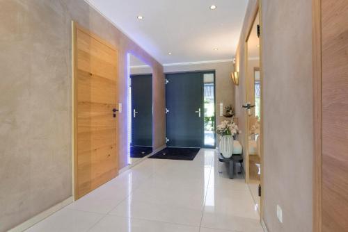 a hallway of a home with a door and a table at Luxuriöse Fewo Schaffner in Warendorf