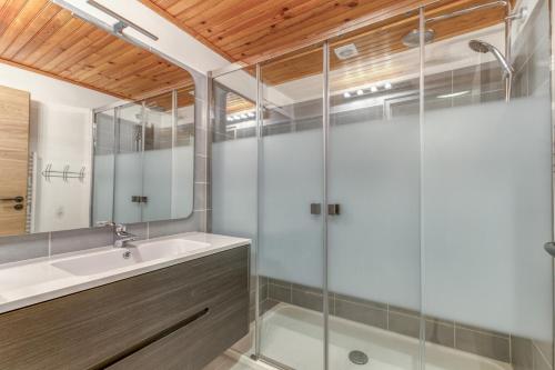 a bathroom with a sink and a shower at Gawal 1 in Villard-Reculas