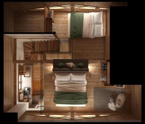 a small room with two bunk beds in it at Baita Valon - Alpine Hideaway in Comano Terme