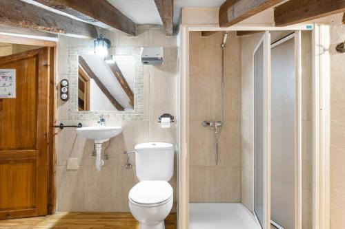 a bathroom with a toilet and a sink at La Carrasca - Limón in Catral