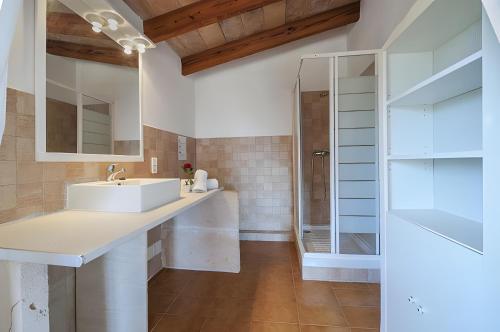 a bathroom with a sink and a shower at Can Toni in El Port