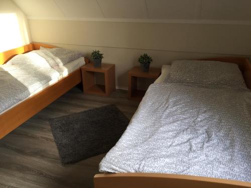 Katil atau katil-katil dalam bilik di Beachhouse Tossens