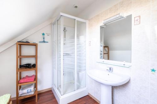 a bathroom with a sink and a shower at Maison de vacances 4 pers in Saint-Just