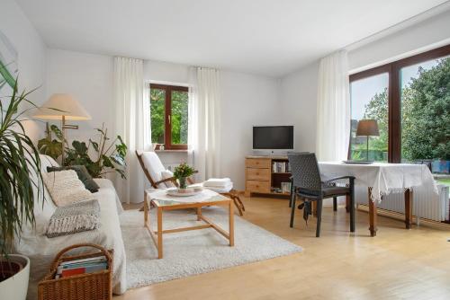 a living room with a couch and a table at Lieblingsnest in Grübels