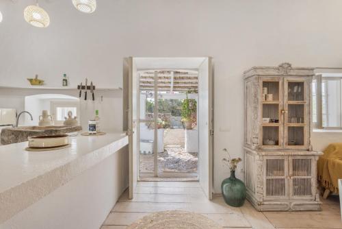 a kitchen with a counter and a dining room at Can Xicu in Illes Balears