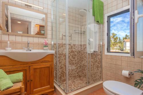 a bathroom with a shower and a sink at Arbocers in Ciutadella