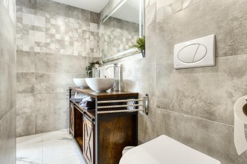 a bathroom with a sink and a basketball sign on the wall at Park Carpe Diem in Busot