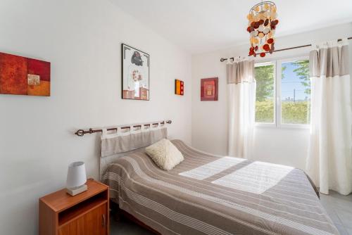 เตียงในห้องที่ Villa de Maithe