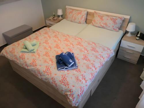 a bedroom with a bed with two bags on it at Ferienwohnung Seepferdchen in Heiligenhafen