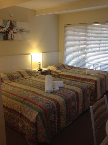 Postel nebo postele na pokoji v ubytování Motel Farnboro