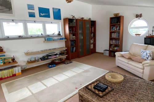 a living room with a couch and a table at Monte Azul, Um Oásis No Alentejo in Vimieiro