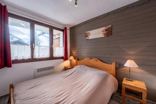 Un pat sau paturi într-o cameră la Chalet Le Chamois