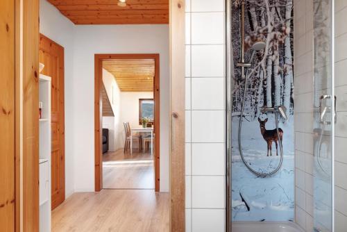 a home with a glass door leading to a dining room at Ferienwohnung Steinhart in Lenzkirch