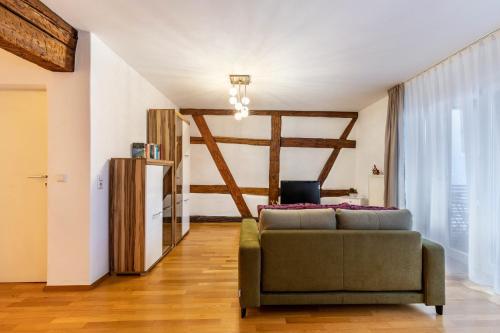 a living room with a couch and a window at Alte Schule in Münsingen