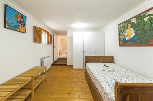 a room with two beds and a staircase in it at Alquimia, Alchemy, Alchimie in São Luis