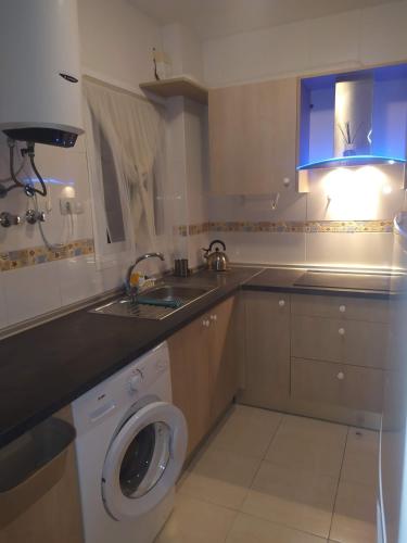 a kitchen with a washing machine and a sink at Cerca plaza de Toros Vera in Vera