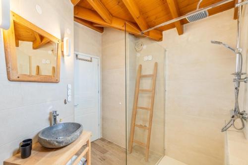 a bathroom with a sink and a shower at Villa Konstantina Lulas Penthouse in Petrití