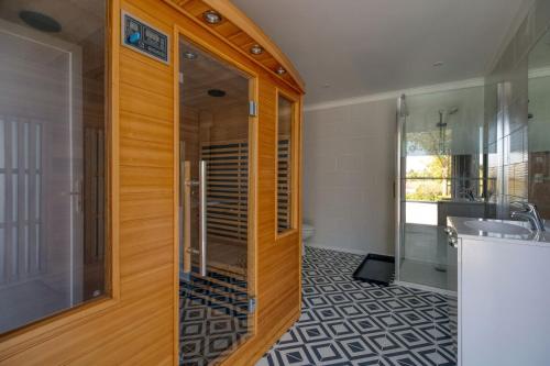 a bathroom with a shower and a sink at Villa Virginie gite 2 in Faudoas