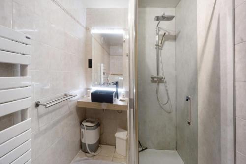 a bathroom with a shower and a toilet and a sink at Chez Stephane et Estelle in Villarodin-Bourget