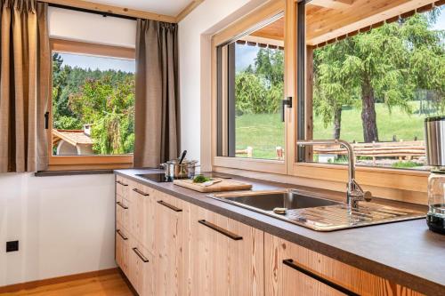 a kitchen with a sink and a window at Feichterhof in San Genesio Atesino