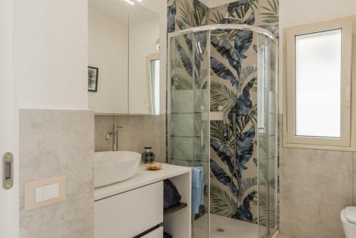 a bathroom with a shower and a sink at Sunset Dimora in Siculiana Marina
