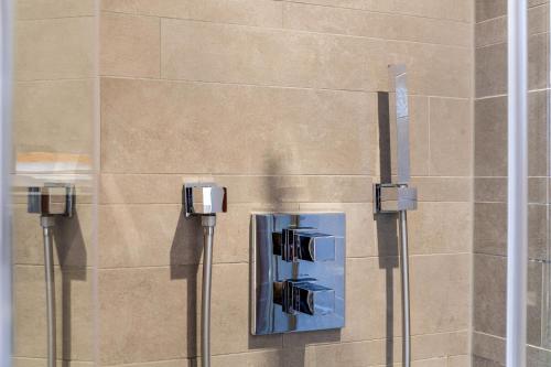 a wall with two electrical devices on the side of a building at Haus Alpenquelle Seeblick in Bad Kohlgrub