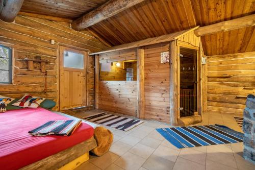 a bedroom of a cabin with a bed in it at Kolbatzer Mühle in Lychen