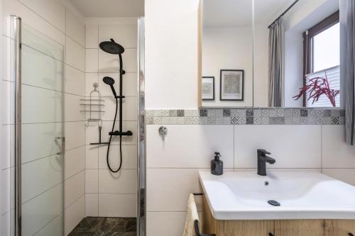a bathroom with a shower and a sink at Marla in Lauterbach