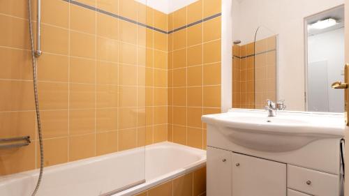 a bathroom with a sink and a tub and a shower at Virginia N104 - ST2 in Grasse