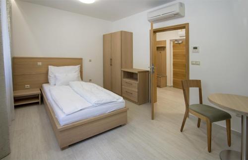 Postel nebo postele na pokoji v ubytování HOTEL A RESTAURACE U STAVAŘE