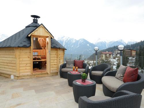 a gazebo with couches at Hotel Garni Alpenjuwel in Serfaus