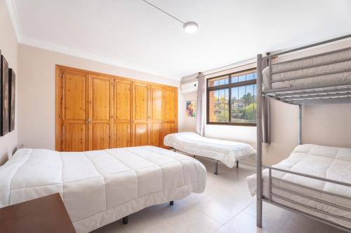 a bedroom with two bunk beds and a window at Castellana in Bicorp