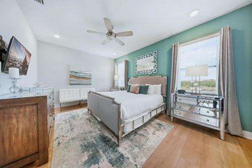 a bedroom with a bed and a window at Serene Vibrant 4 Bdrm Villa with Games Room at Encore in Orlando