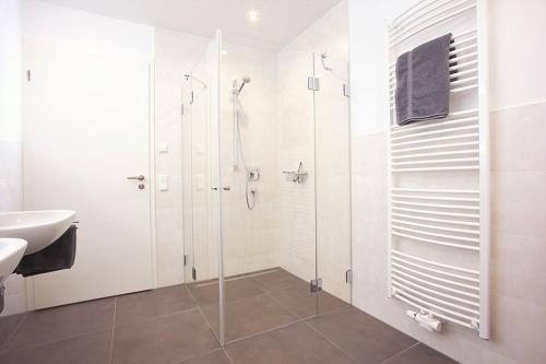 a bathroom with a shower and a sink at Ferienhaus Am Rösslewald in Breitnau