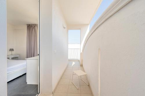 a room with a hallway with a bed and a mirror at Case Vacanze Otranto in Otranto