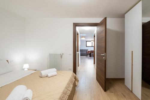 a bedroom with a bed and a hallway at La Tavernetta di Elisa in Calimera